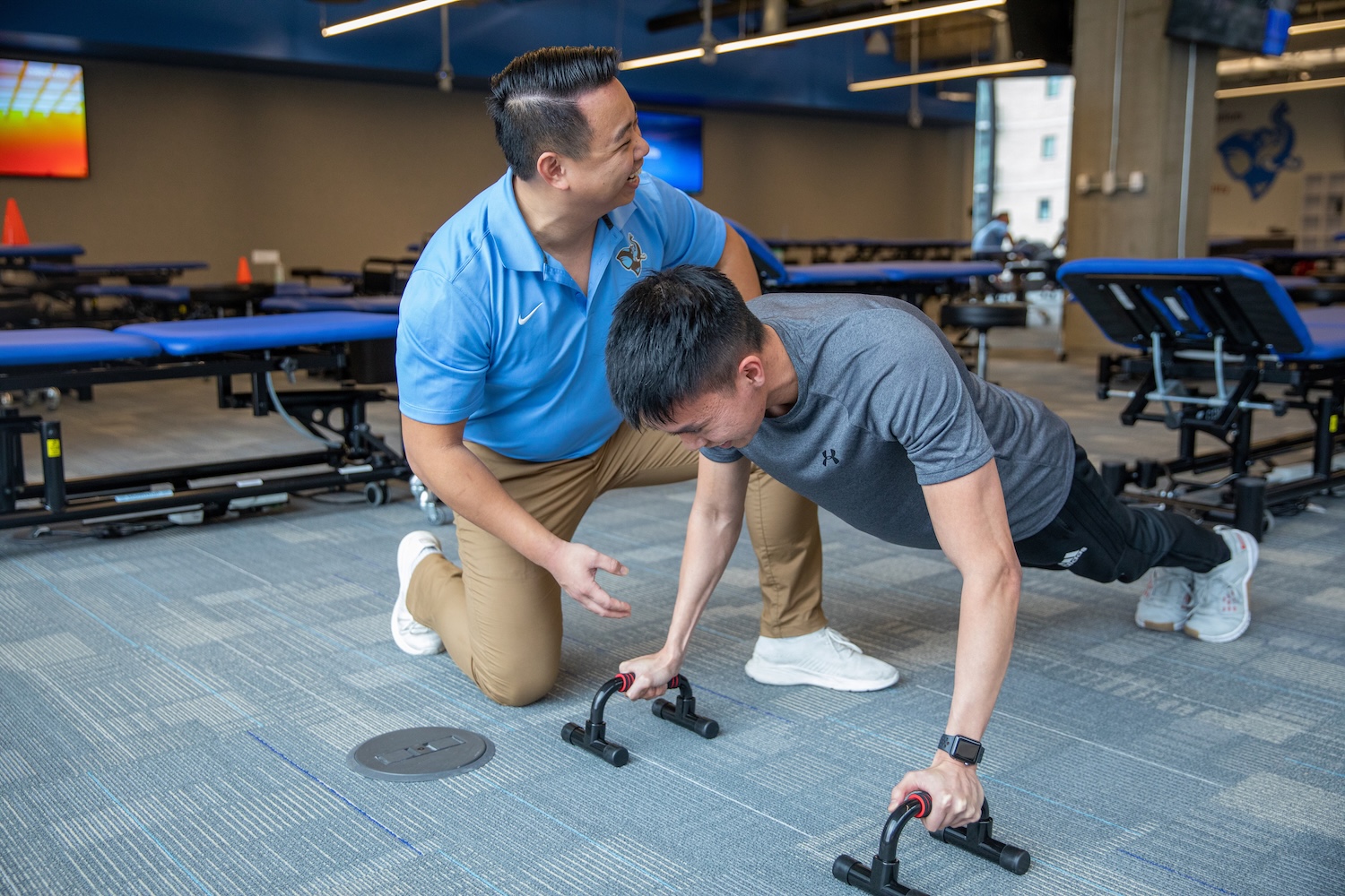 man doing physical therapy to strengthen arms
